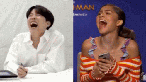 Man And Woman Laughing Woman Holding Cell Phone GIF