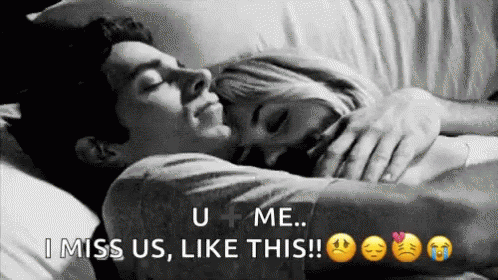Man and Woman Laying in Bed Hugging