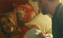 Man And Woman Laying In Bed With Baby GIF
