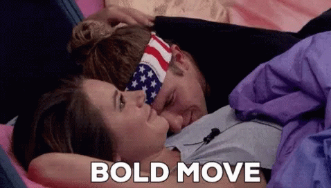 Man and Woman Laying on Bed Saying Bold Move