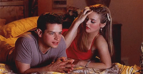 Man And Woman Laying On Bed Woman Touching Man's Head GIF