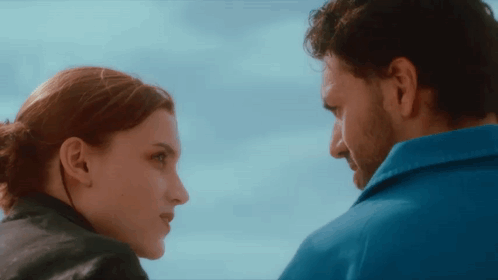 Man and Woman Looking at Each Other Blue Sky