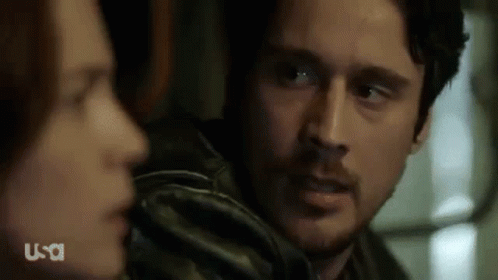 Man And Woman Looking At Each Other Close Up GIF