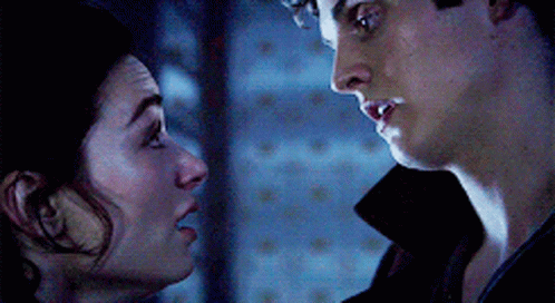 Man and Woman Looking at Each Other Eyes Closed