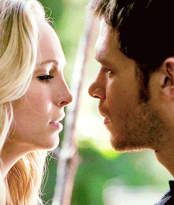 Man and Woman Looking at Each Other Eyes Closed