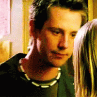 Man and Woman Looking at Each Other, Man With Necklace