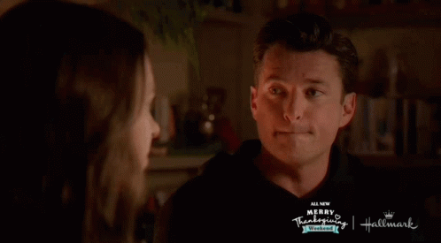 Man And Woman Looking At Each Other Merry Thanksgiving Hallmark GIF