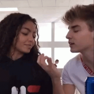 Man And Woman Looking At Each Other GIF