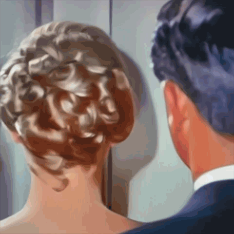 Man and Woman Looking at Each Other with Woman's Hair Bun