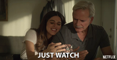 Man and Woman Looking at Phone Netflix Ad