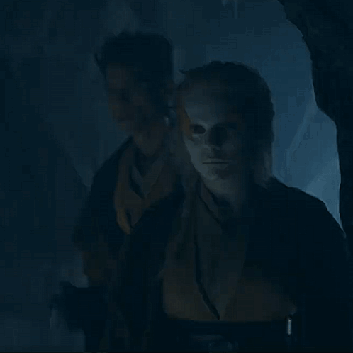 Man and Woman Looking in Dark Room
