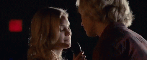 Man And Woman Looking Into Each Other's Eyes GIF