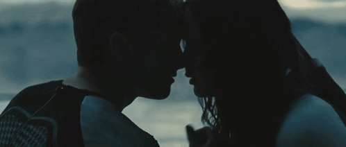 Man And Woman Looking Into Each Other's Eyes In The Dark GIF