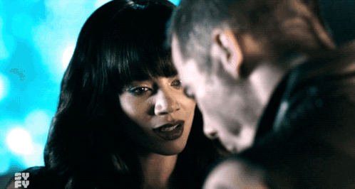 Man And Woman Looking Into Each Other's Eyes With SV FY GIF