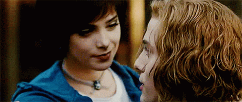 Man and Woman Looking Into Each Other's Eyes Woman in Blue Jacket