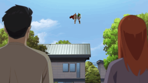 Man and Woman Looking Up at Superhero Over House