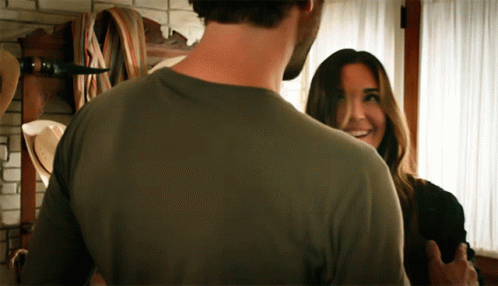 Man and Woman Looking, Woman Smiling