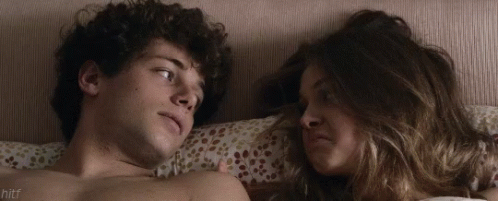 Man and Woman Lying on Bed Hitf