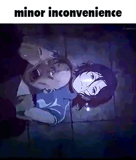 Man and Woman Lying on Tiled Floor in Dark Room