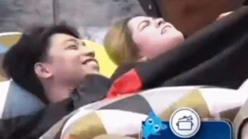 Man and Woman Lying on Top of Each Other in Bed