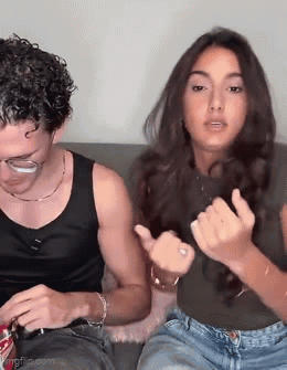Man and Woman Making Funny Faces on Couch