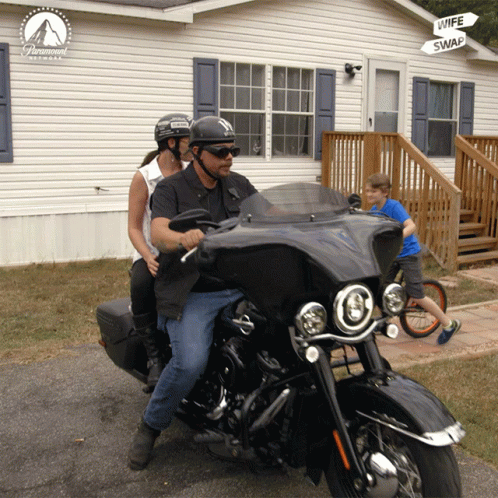 Man and Woman Motorcycle Paramount Pictures House