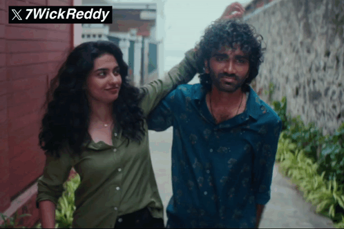 Man and Woman Next to 7wick Reddy Logo