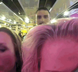 Man and Woman Next to Each Other in Pink Room