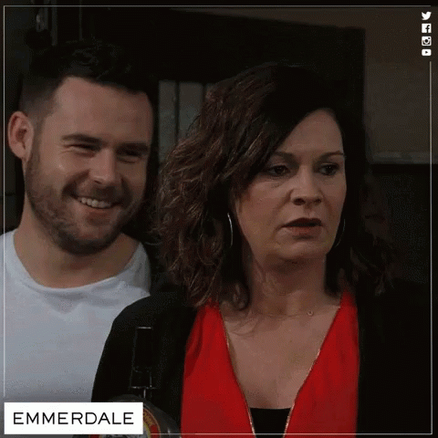 Man And Woman Next To Emmerdale GIF