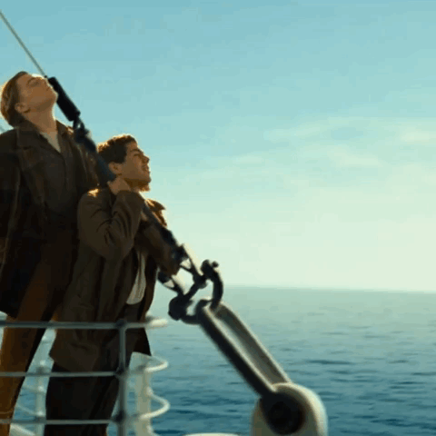 Man And Woman On A Boat In The Ocean GIF