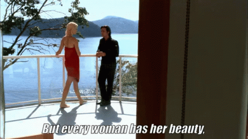 Man and Woman on Balcony With But Every Woman Has Her Beauty