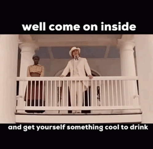 Man and Woman on Balcony With Text Well Come on Inside