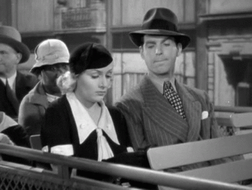 Man And Woman On Bench In Black And White Photo GIF
