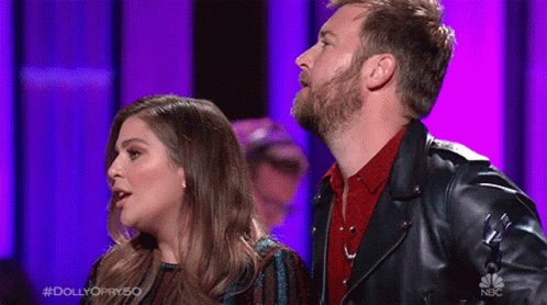 Man and Woman on Stage Man in Leather Jacket
