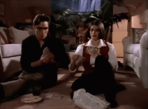 Man And Woman Playing Cards GIF