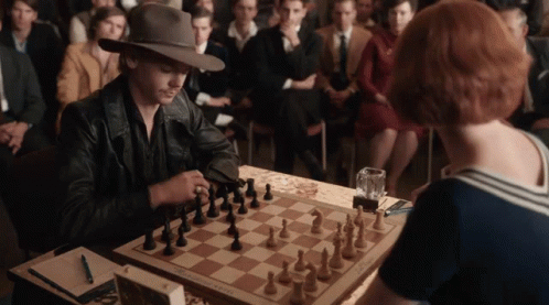 Man And Woman Playing Chess GIF
