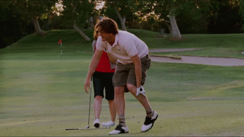 Man And Woman Playing Golf GIF