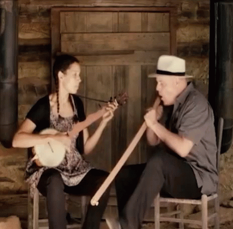 Man and Woman Playing Musical Instruments