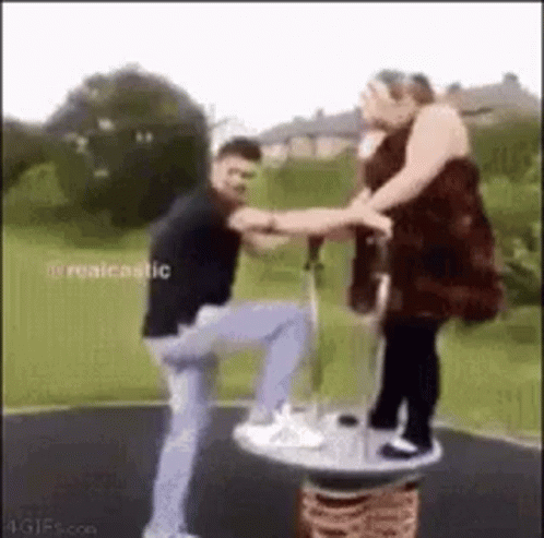 Man and Woman Playing on Merry-Go-Round