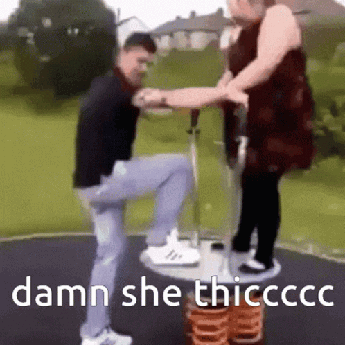 Man and Woman Playing on Playground With Damn She Thicccc