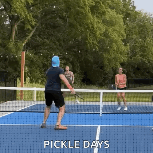 Man and Woman Playing Pickleball