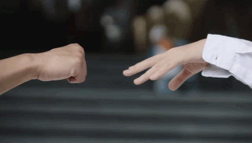 Man and Woman Playing Rock Paper Scissors