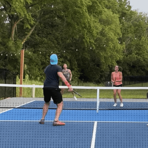 Man and Woman Playing Tennis