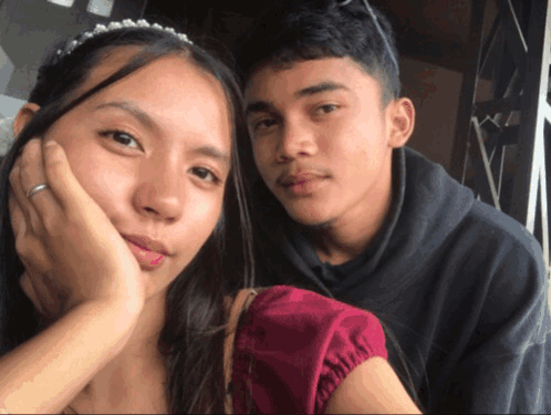 Man and Woman Posing for Photo
