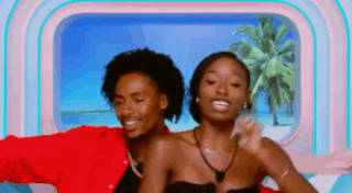 Man And Woman Posing In Front Of Window GIF