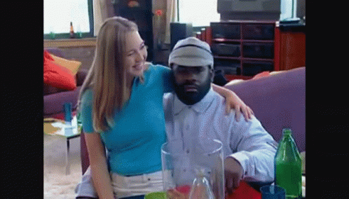 Man And Woman Posing On Couch GIF