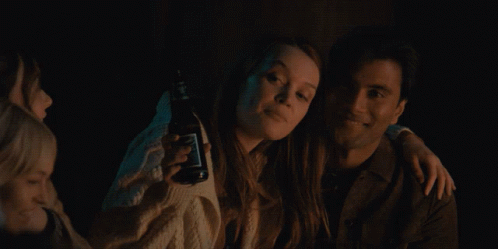 Man and Woman Posing, Woman Holds Jack Daniels