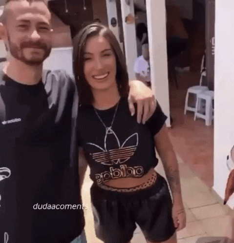 Man and Woman Posing, Woman in Black Adidas Shirt