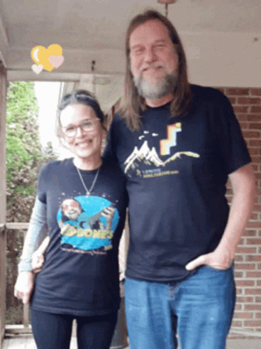 Man and Woman Posing Woman Wearing Rock Phones Shirt