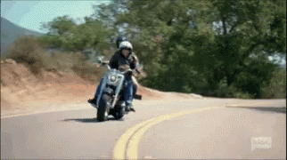 Man and Woman Riding Motorcycle